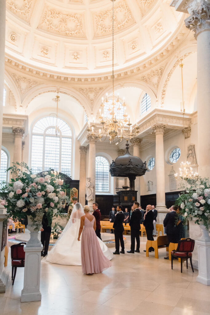 Destination wedding florist altar design with hydrangeas and roses in historic London chapel