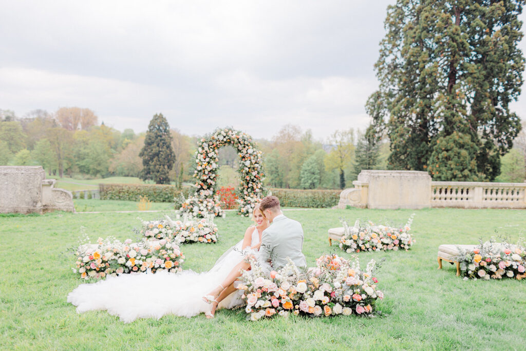 Luxury floral ceremony arch on lawn of French château