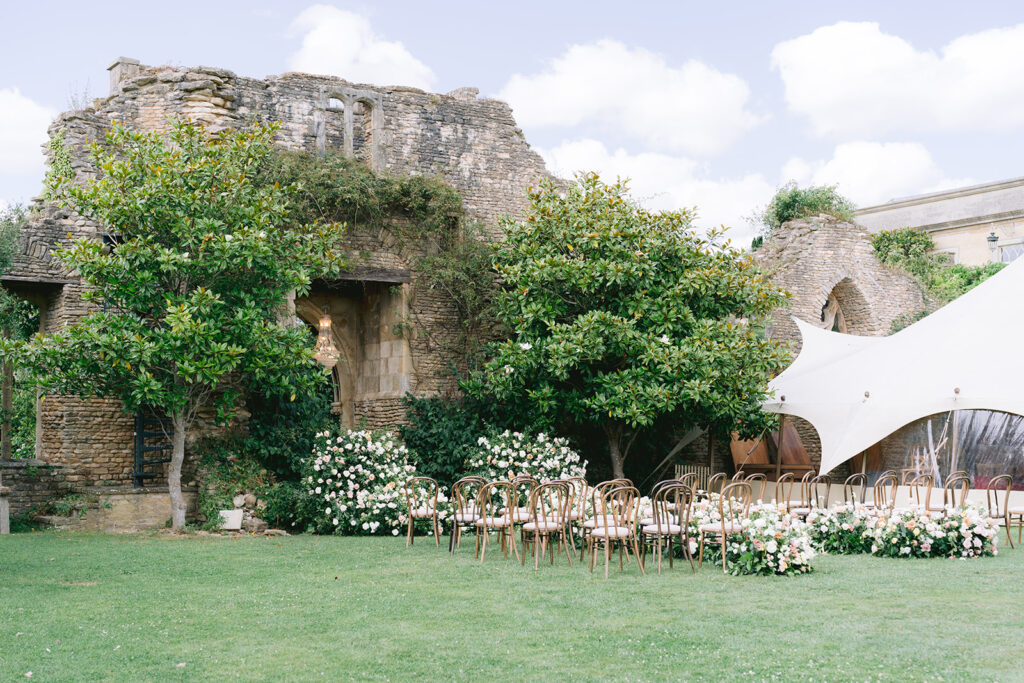 Euridge Manor cotswolds wedding venue ceremony chandelier flowers by Flourish and Grace