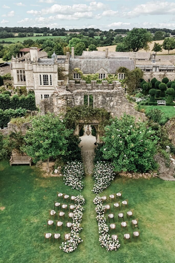 Euridge Manor cotswolds wedding venue ceremony chandelier flowers by Flourish and Grace