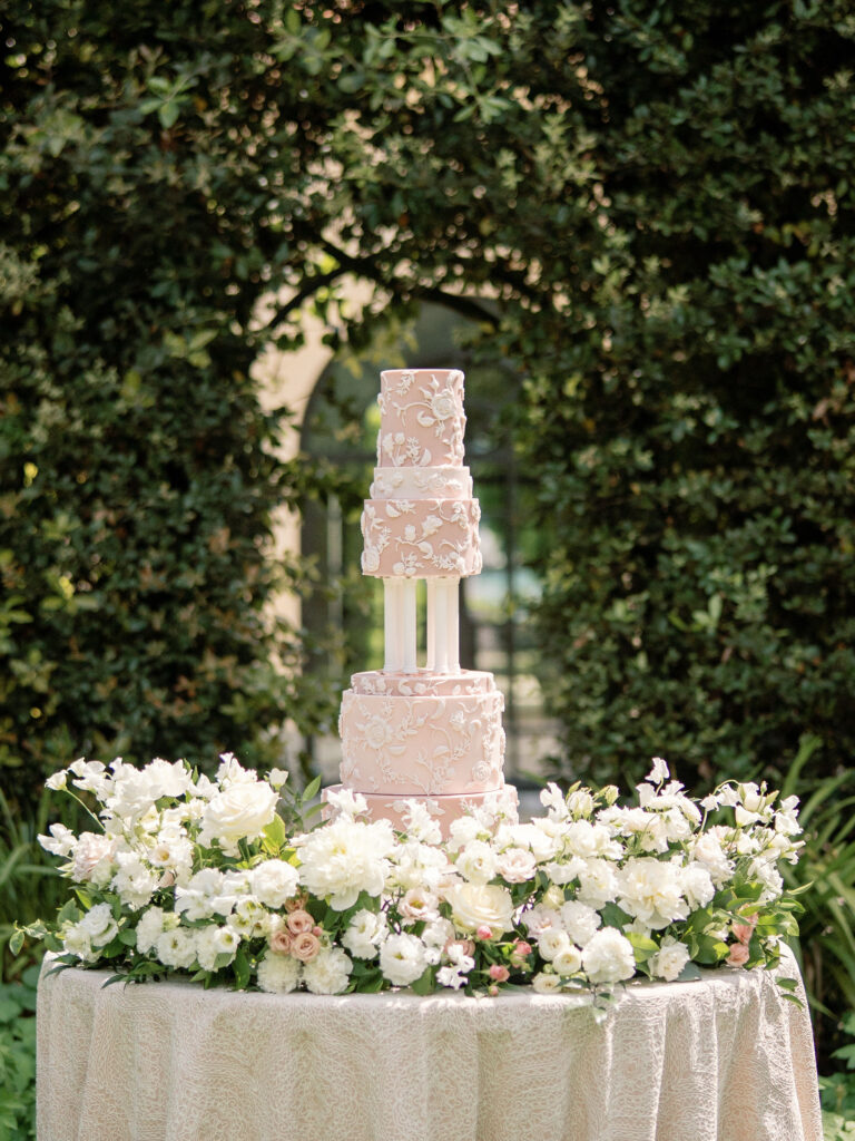 White wedding cake at Villa Balbiano, Lake Como with flowers by florist flourish and grace