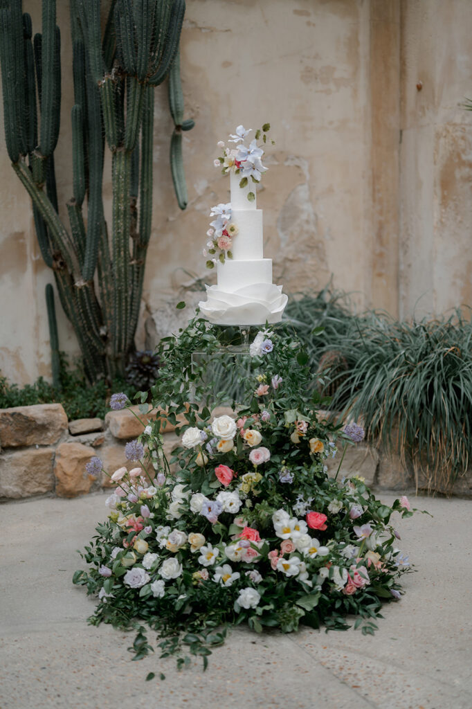 Syon Park wedding flowers with cake by Anna Lewis